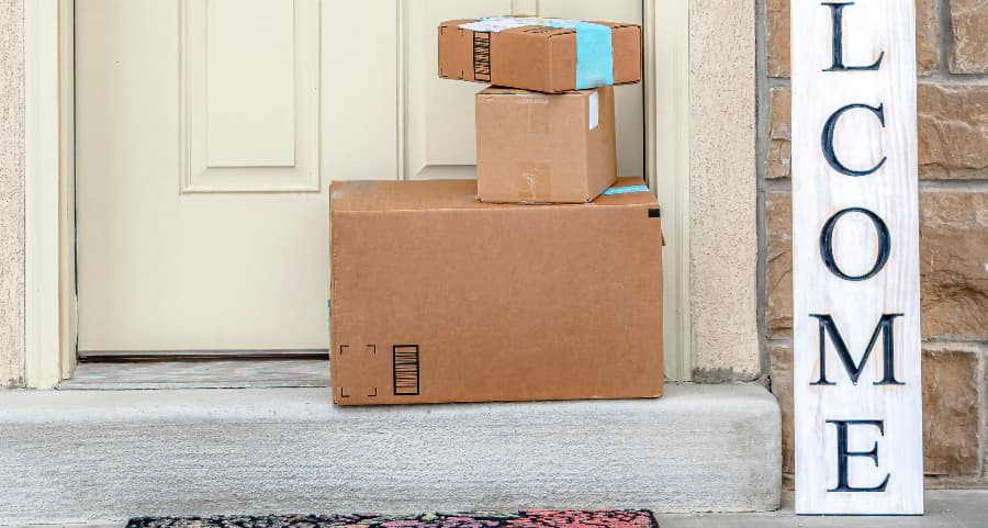 Deliveries on the front porch of a house with a welcome sign in Abilene